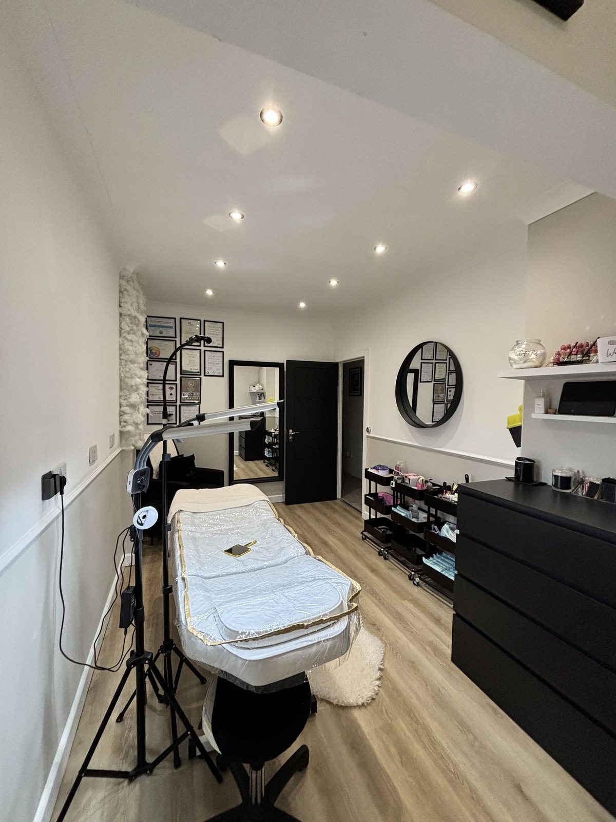 The treatment room, looking along the bed towards the certificate wall