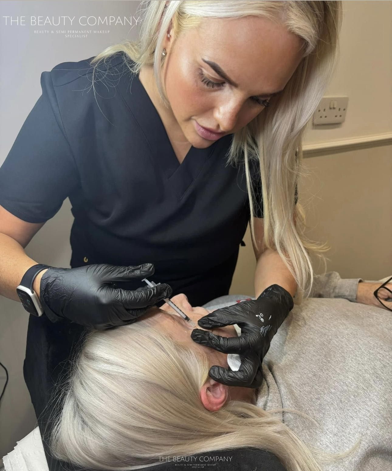 Beth working on a client’s brows in the treatment room